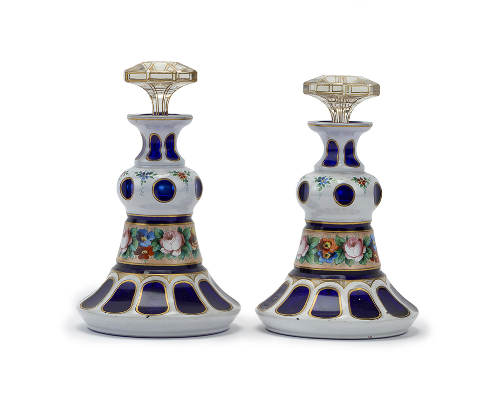 A pair of Bohemian cut glass perfume bottles