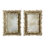 A pair of carved wall mirrors