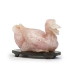 A Chinese carved rose quartz duck on wood stand