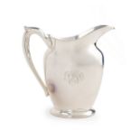 A sterling handled water pitcher