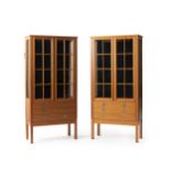 A pair of diminutive upright vitrine cabinets