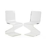 A pair of Lucite zig-zag chairs