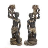 A pair Venetian polychrome seated Blackamoors