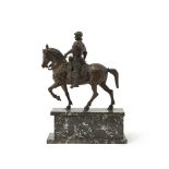 A patinated bronze horse and rider