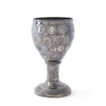 A silver coin-set chalice