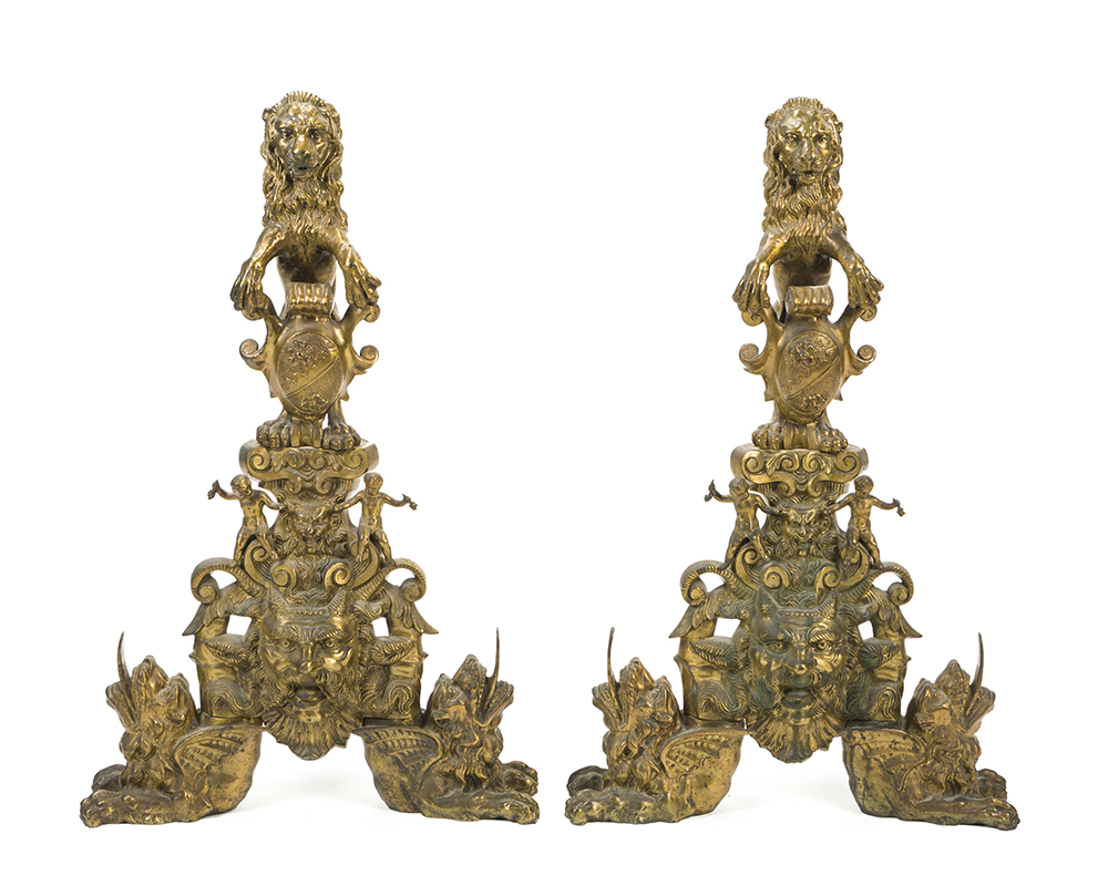 A pair of gilt bronze and cast iron andirons