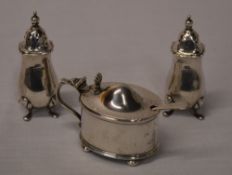 Pair of silver pepperettes, Birmingham 1936 and a mustard pot,