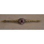Tested as 18ct gold diamond and ruby bar brooch, total approx weight 4.