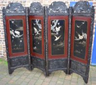 An impressive Japanese four panel lacquered screen,