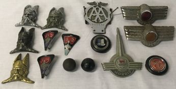 Vintage car badges including Rover, Morris,