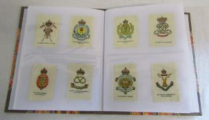 Album containing approximately 144 printed silks inc regimental badges