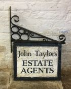 Hand made wrought iron hanging sign on bracket