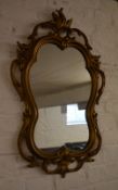 Ornate gilt framed wall mirror