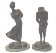 Pair of bronze effect golfing figures