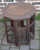 Ornately carved eastern octagonal occasional table with pieced fretwork panelling