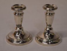 Pair of silver candlesticks (weighted)