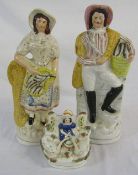 Pair of Staffordshire figures of a fisherman and his wife H 34 cm & a girl feeding swans