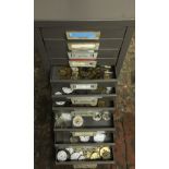 Small filling cabinet containing mainly pocket watch parts.