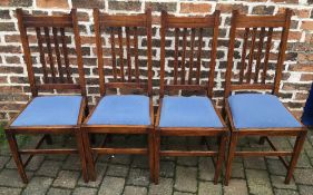 Four oak dining chairs.