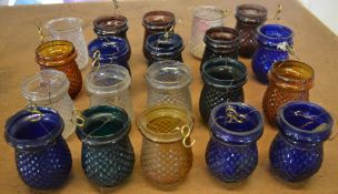 Approx 20 early 20th century coloured glass jars / candle holders (AF)