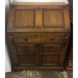 Oak bureau with linen fold panels