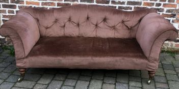 Large Victorian button back sofa on turned legs & casters
