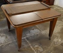 Wind out oak dining table with one leaf