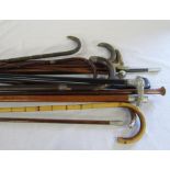 Bundle of walking sticks and swagger sticks inc some with silver cuffs / mounts