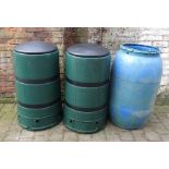 2 compost bins and a water barrel