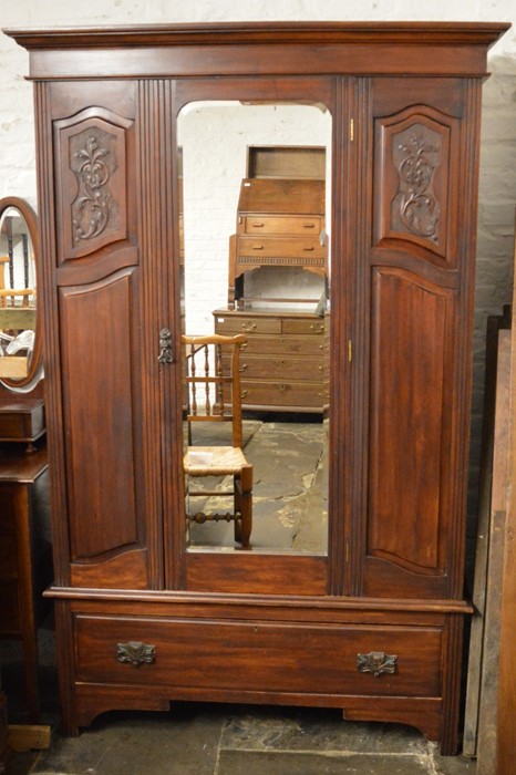Carved late Victorian  wardrobe with mirror door
