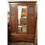 Carved late Victorian  wardrobe with mirror door