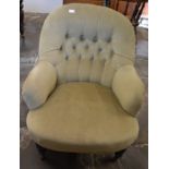 Victorian button back armchair on turned legs with casters