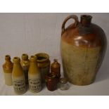 Stoneware bottles including Winch & East of Louth & a large demijohn