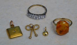 Small yellow metal locket gypsy set with a tiny diamond, 9ct gold knot pendant, small yellow metal