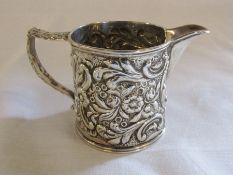 Ornate silver jug hallmarks indistinguishable H 7 cm weight 4.41 ozt