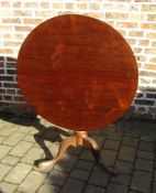 Georgian oak tilt top table on a tripod base