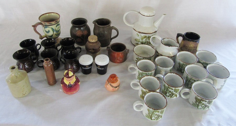 Selection of studio pottery & novelty pepper pots inc Guinness, Stan Laurel etc