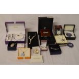 Various boxed gift items including necklaces, hip flask, earrings etc