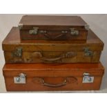 3 vintage leather suitcases