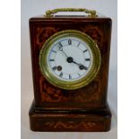 Small 19th century French table clock in an inlaid rosewood case. Back plate engraved Louis Et Miera