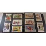 Postcard album containing approximately 400 comic postcards dating from 1900s onwards