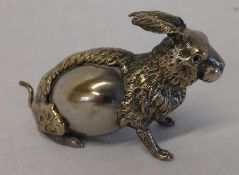 Early 20th century gilt metal rabbit form tape measure with winding tail