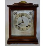 19th century bracket clock in a mahogany case with a silvered dial, bevelled glass side panels,