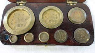 Cased set City of Lincoln standard brass weights (1 missing)