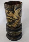Japanese gold lacquered tortoiseshell brush pot on ebonised stand H 22cm (the tortoiseshell cylinder