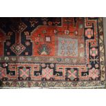 Red & blue ground Middle Eastern carpet 285cm by 163cm