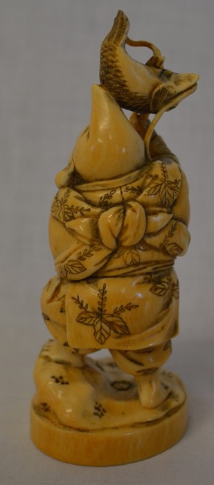 Meiji period carved ivory okimono depicting a fisherman with carp above his head Ht 13cm - Image 2 of 5