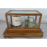 Manoah Rhodes & Sons Ltd Bradford oak cased barograph with bevelled glass panels and chart drawer