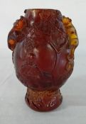 Carved Chinese amber vase with raised dragons and base mark 19cm