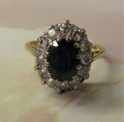18ct gold sapphire and diamond oval cluster ring (sapphire approximately 1.4 ct, diamond total 0.